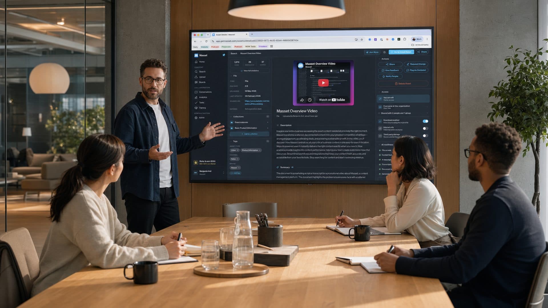 A team reviewing a Masset asset together on the conference room screen